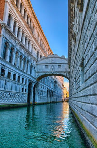 View of bridge over canal in city