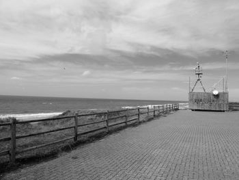 Seashore with antenna architecture and  long fence