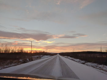 Road against sky during winter