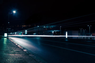 Light trails on road in city at night