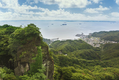 Tanker boats sailing on the uraga channel with the kanaya fishing village of  boso peninsula.