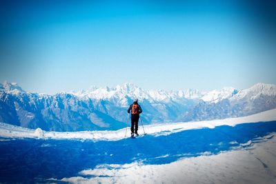 People standing on snow covered landscape