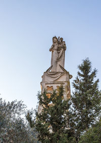 Low angle view of statue against clear sky