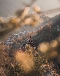 Man on field by mountains