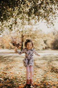 Full length of a girl standing outdoors