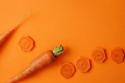 High angle view of orange and knife on floor