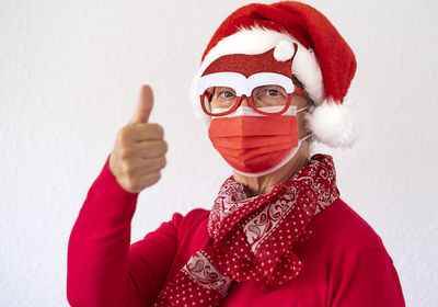 Portrait of man with red christmas decoration