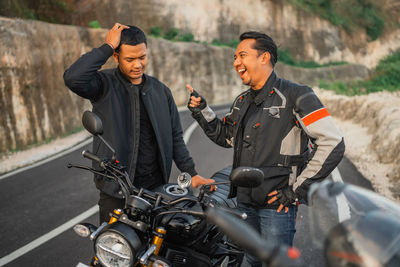 Man riding motorcycle on road