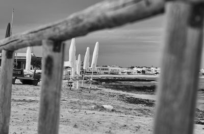 Built structure by water against sky