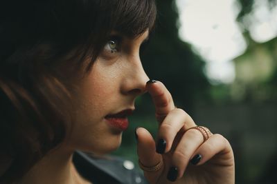 Close-up of young woman looking away