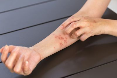Close-up of hands on table