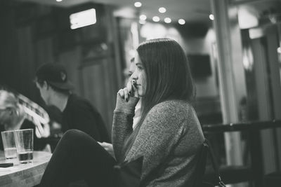 Close-up of woman standing on bench