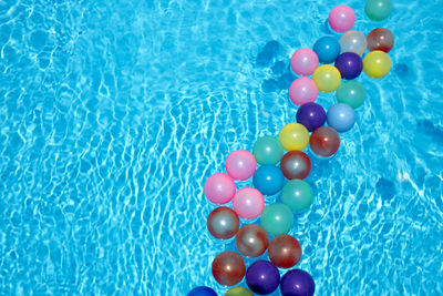 High angle view of multi colored ball in swimming pool