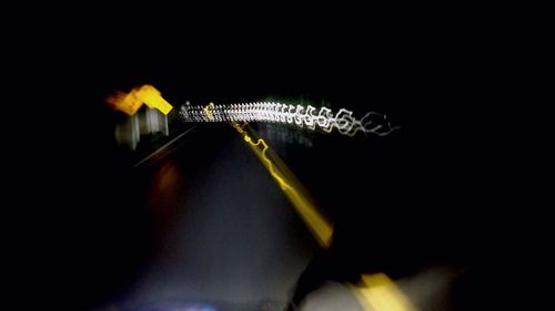 Close-up of insect against black background