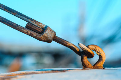 Close-up of rope tied on rusty metal