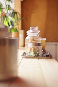 Close-up of glass jar on table