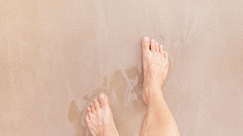 Low section of man legs on floor