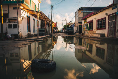 Water puddle reflection in mexico, holbox island after heavy rain storm