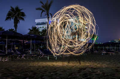 Illuminated ferris wheel at night