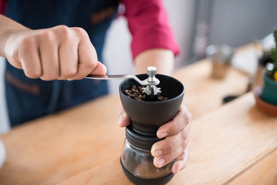 Midsection of person preparing food on table