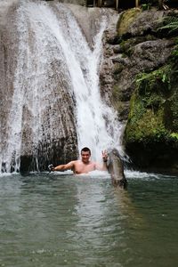 View of man swimming in water