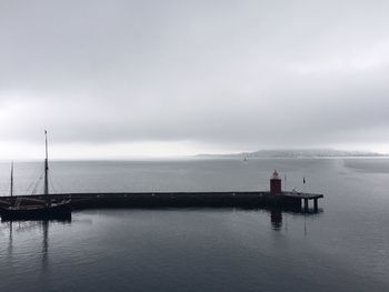 Incredible light for a rainy and gray day over the harbor, aerial view, pier and harbor. horizon sea 