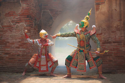 Full length of man wearing traditional clothing while dancing