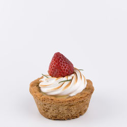 Close-up of cake against white background