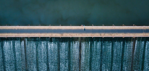 Low angle view of bridge against wall