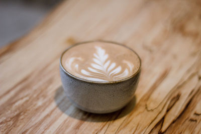 Close-up of coffee cup on table