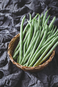 High angle view of vegetables in basket on table