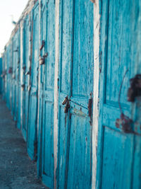 Close-up of blue metal door