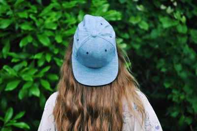 Portrait of woman against plants