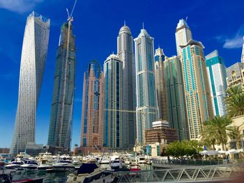 Panoramic view of modern buildings against sky in city