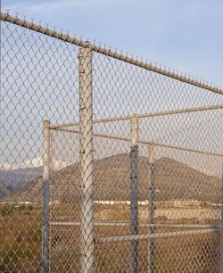 Chainlink fence against sky