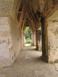 Narrow corridor along old building