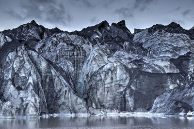 Scenic view of frozen lake against mountain