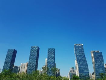 Modern buildings against blue sky