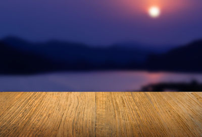 Close-up of wood against lake