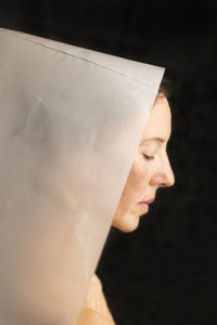 Woman in white paper hood