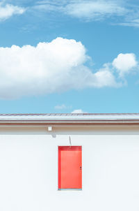 Red building against sky