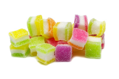 Close-up of chopped candies against white background