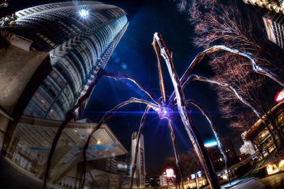 Low angle view of illuminated building at night