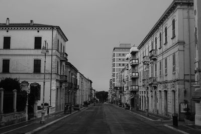 Road leading towards buildings