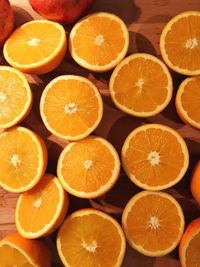 High angle view of orange slices on wooden table