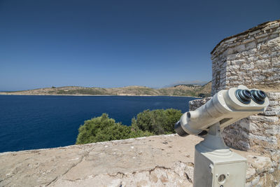 Scenic view of sea against clear blue sky