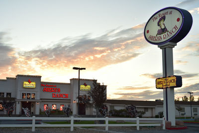 View of road sign at sunset