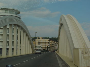 Road amidst buildings in city