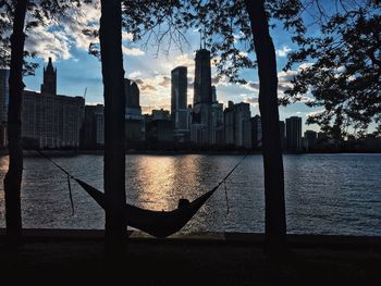 Silhouette of buildings at waterfront