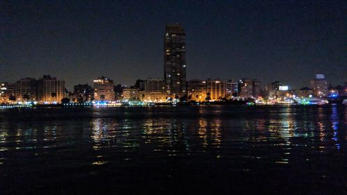 Illuminated buildings in city at night